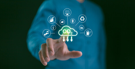 Businessman point to increasing arrow with carbon reduction for decrease CO2, Green house Global Economy concept. Carbon footprint and carbon credit to limit global warming from climate change.