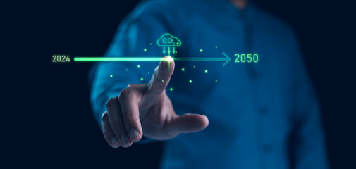 Businessman point to increasing arrow with carbon reduction for decrease CO2, Green house Global Economy concept. Carbon footprint and carbon credit to limit global warming from climate change.