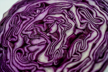 Obraz premium Background slice of red cabbage. Cut red cabbage.