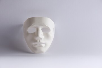Plastic face mask on white background, space for text. Theatrical performance