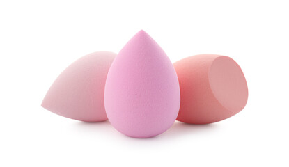 Pink and beige makeup sponges isolated on white