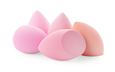 Pink and beige makeup sponges isolated on white