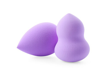 Two violet makeup sponges isolated on white