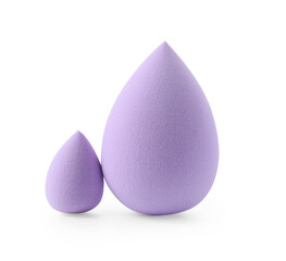 Two violet makeup sponges isolated on white