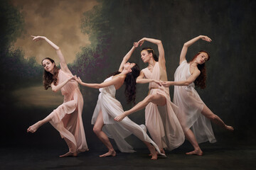 Timeless Grace. Quartet of ballerinas in elegant dresses perform synchronized dance routine against...