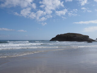 Beach with rock in European Foz city in Galicia province at Lugo in Spain