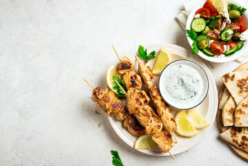 Chicken skewers ans greek vegetable salad