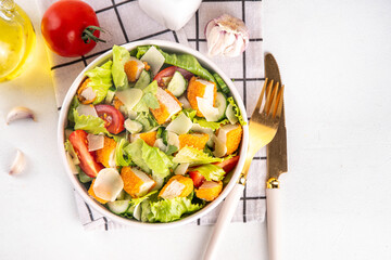 Fried Chicken Salad. Balanced salad with crispy chicken nuggets, fresh vegetables and cheese, copy space