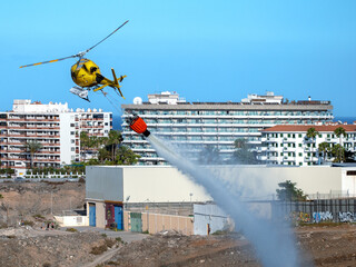 Fire brigade helicopter on a fire-fighting mission in Gran Canaria