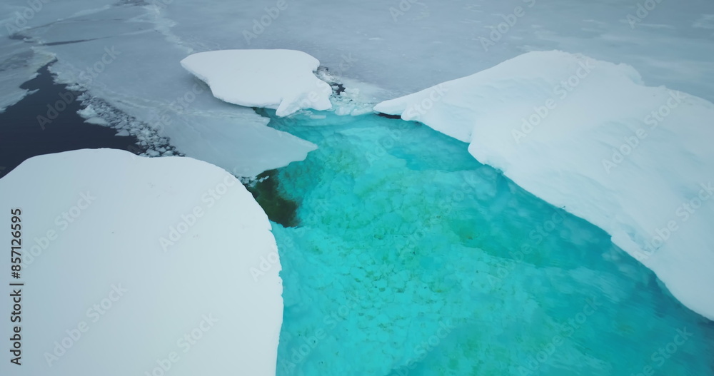 Wall mural Antarctica melting blue water iceberg. Antarctic ocean environment. Nature lake with blue water and broken ice flow. Ecology, melting ice, climate change, global warming concept. Aerial drone flight - Wall murals