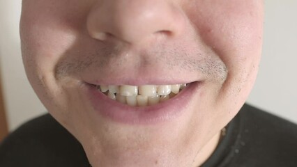 close up part male face, plump lips young man, slight smile, playfully mimics blown kiss, message of love and romantic affection, age-related changes