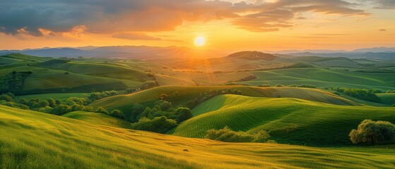 Obraz premium Golden Sunset Over Rolling Hills.