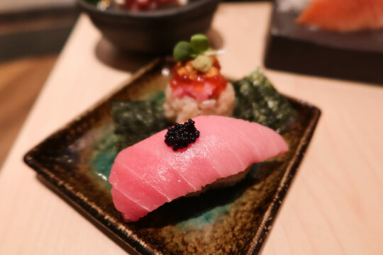 close up of Japanese sashimi seafood fish chu toro (fatty tuna) sushi on a plate