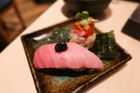 close up of Japanese sashimi seafood fish chu toro (fatty tuna) sushi on a plate