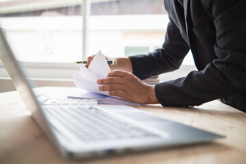 A pile of documents that the secretary has prepared for meetings of the company board of directors and investors. Many documents were arranged and prepared in piles on the desk in the secretary office