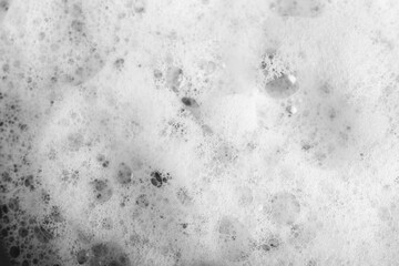 White foam with bubbles as background, top view