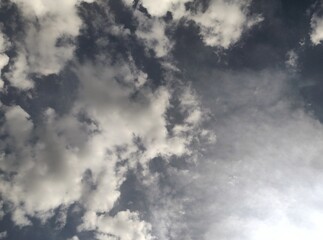 Sunlight Peeking Through Dynamic Cloudscape - A Serene Sky View Inspiring Tranquility and Wonder