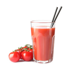 Tasty tomato juice in glass and fresh vegetables isolated on white