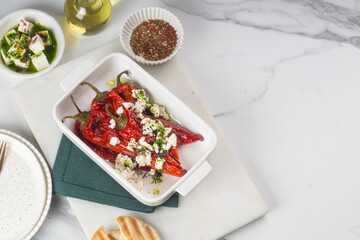 Grilled Peppers with Feta Cheese and Pita Bread on a Rustic Table for a delicious appetizer