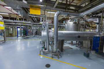 Process heat exchanger at the insulation in process area of pipeline flowing stainless chemical in a factory