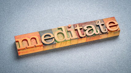 Fototapeta premium meditate word, text in retro letterpress wood type stained by color inks