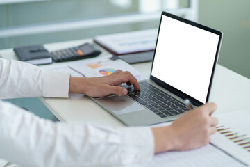 Fototapeta premium Business man working using laptop computer Hands typing keyboard. Professional investor working start up project. business planning in office. Technology business Concept