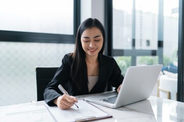 Beautiful Business Woman working by using laptop computer Hands typing on keyboard. Professional investor working new start up project. business planning in office. Technology business Concept