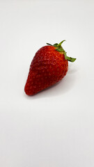 Bright juicy red strawberries. Beautiful strawberries on a white background. One strawberry macro