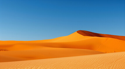 orange sand dunes under clear blue sky