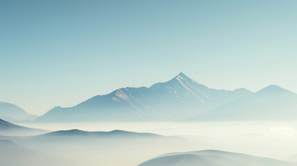 misty mountain peaks under a clear sky