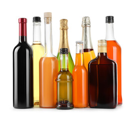 Bottles of different alcoholic drinks isolated on white