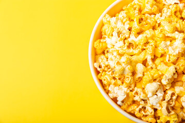 Delicious popcorn on background. Cinema and entertainment concept. Movie night with popcorn. Cheese and caramel popcorn. Delicious appetizer, snack. Place for text. Copy space.Banner