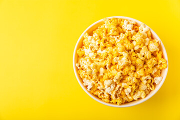 Delicious popcorn on background. Cinema and entertainment concept. Movie night with popcorn. Cheese and caramel popcorn. Delicious appetizer, snack. Place for text. Copy space.Banner