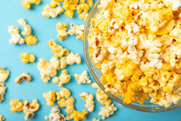 Delicious popcorn on background. Cinema and entertainment concept. Movie night with popcorn. Cheese and caramel popcorn. Delicious appetizer, snack. Place for text. Copy space.Banner