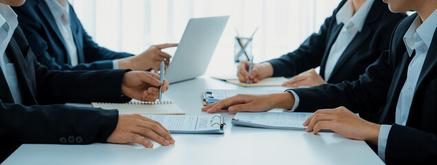 Two business executive in boardroom discuss term and company merging agreement, review corporate...