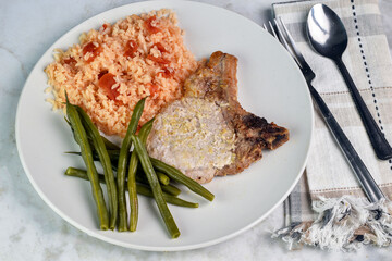 pork chop   with rice  and green beans