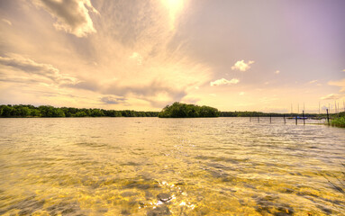 The sun is setting over the landscape at lake "De IJzeren Man" in The Netherlands.
