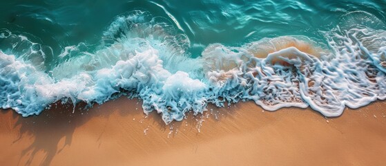 Crystal-clear ocean waves lapping a sandy shore