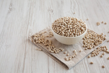 Organic White Beans in a Bowl, side view.