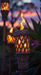 Tiki torches glowing at dusk