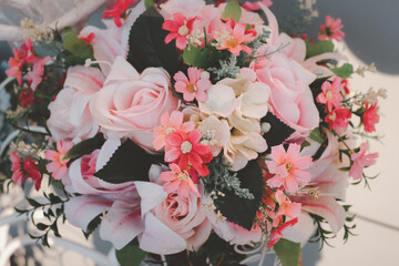 A bouquet of pink flowers with a white center