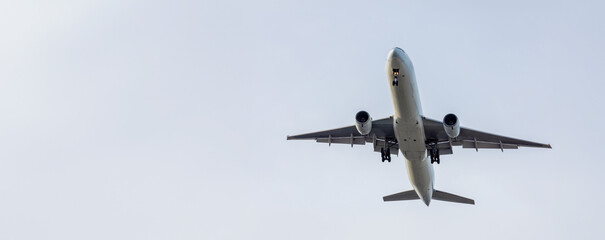 Airplane and sky, the plane is landing. Airplane take off on the blue sky, Aircraft flying on sky background. Passenger plane ready for landing. Low angle view of Airplane flying under blue sky
