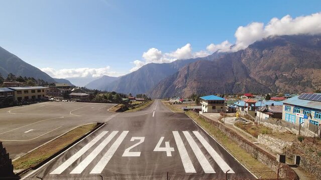 Lukla, Nepal - 14th november, 2023: time lapse small aircraft takes off on the runway of the Tenzing-Hillary airport Lukla - Nepal, Himalayas
