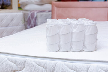 Independent spring blocks packed in spunbond. on mattress. Bonding layers of springs. Furniture and...