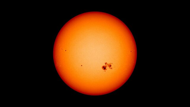 The Sun, rotation of sunspots on surface with solar flares and energy.