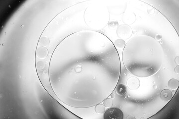 Clear oil on the surface of the water.