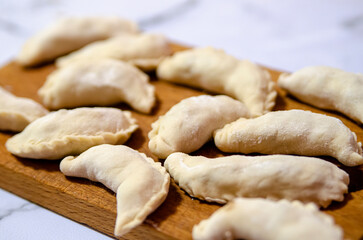 Dumplings, pelmeni, ravioli- homemade raw