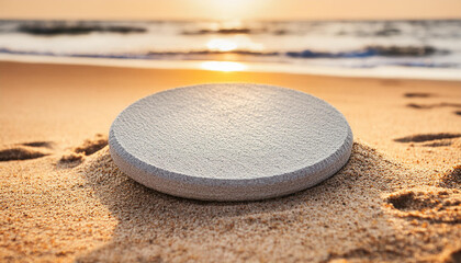 Obraz premium Round stone platform on sandy beach. Pedestal for product presentation. Mock-up. Flat lay