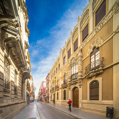 Naklejka premium Calle Alfonso XII with Modernist Laureano Montoto Building, Seville, Spain