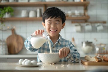 Asian boy pours milk into cereal bowl at table   healthy children s breakfast concept - Powered by Adobe